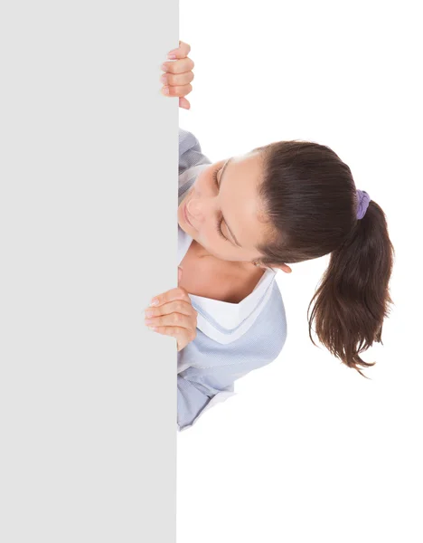 Young maid holding blank placard — Stock Photo, Image