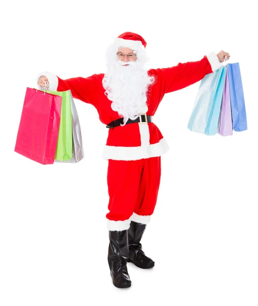 Portrait of santa holding shopping bag — Stock Photo, Image