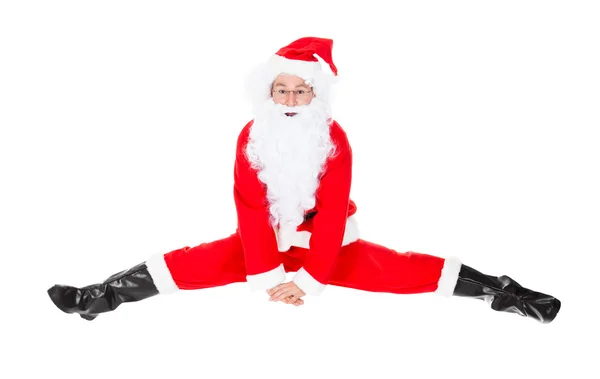 Papai Noel senta-se em uma divisão — Fotografia de Stock