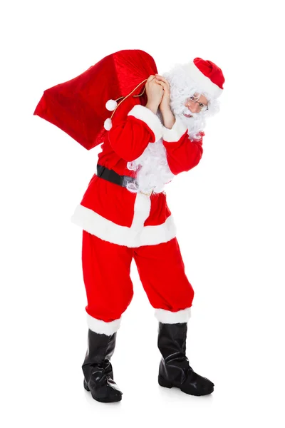 Ritratto di Babbo Natale che porta il sacco — Foto Stock