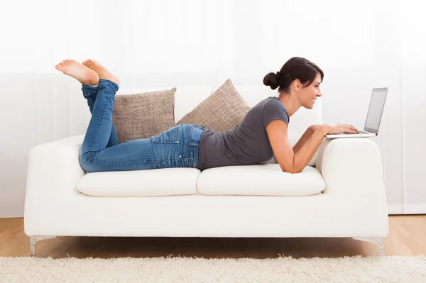 Beautiful Young Woman On A Sofa — Stock Photo, Image