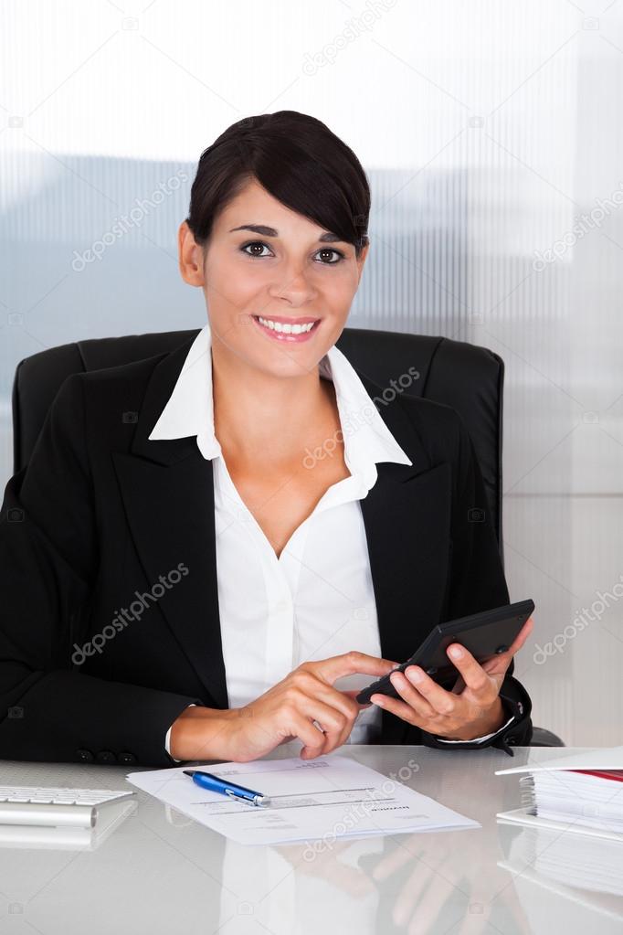 Businesswoman Working With Calculator