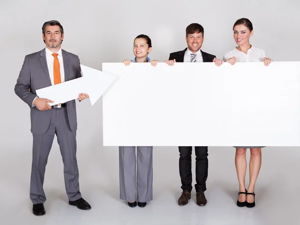 Businesspeople Holding Placard — Stock Photo, Image