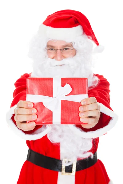 Portrait of a happy santa holding gift — Stock Photo, Image