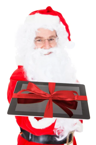 Santa segurando tablet digital — Fotografia de Stock