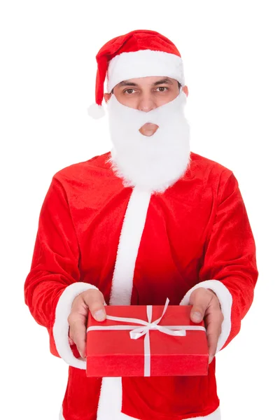 Santa Filling Bag With Gift — Stock Photo, Image