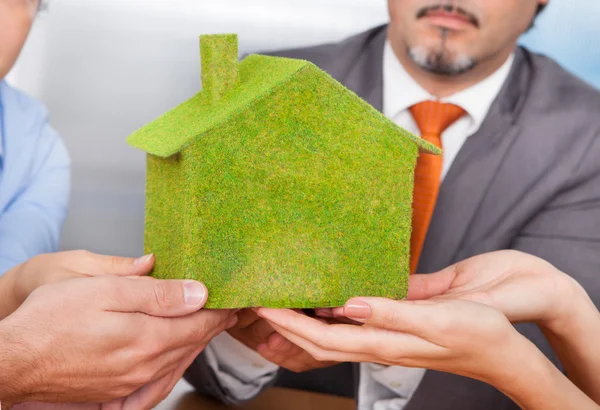 Businesspeople Holding Eco Friendly House — Stock Photo, Image