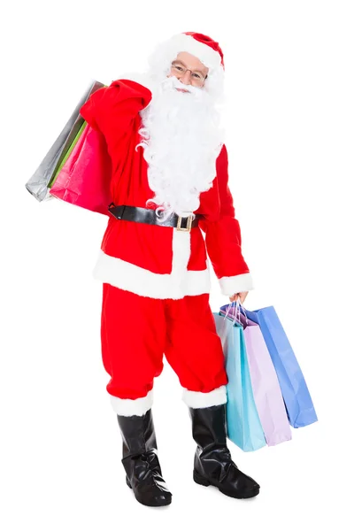 Santa holding alışveriş çantası portresi — Stok fotoğraf