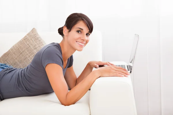 Woman With Laptop On Sofa — Stock Photo, Image