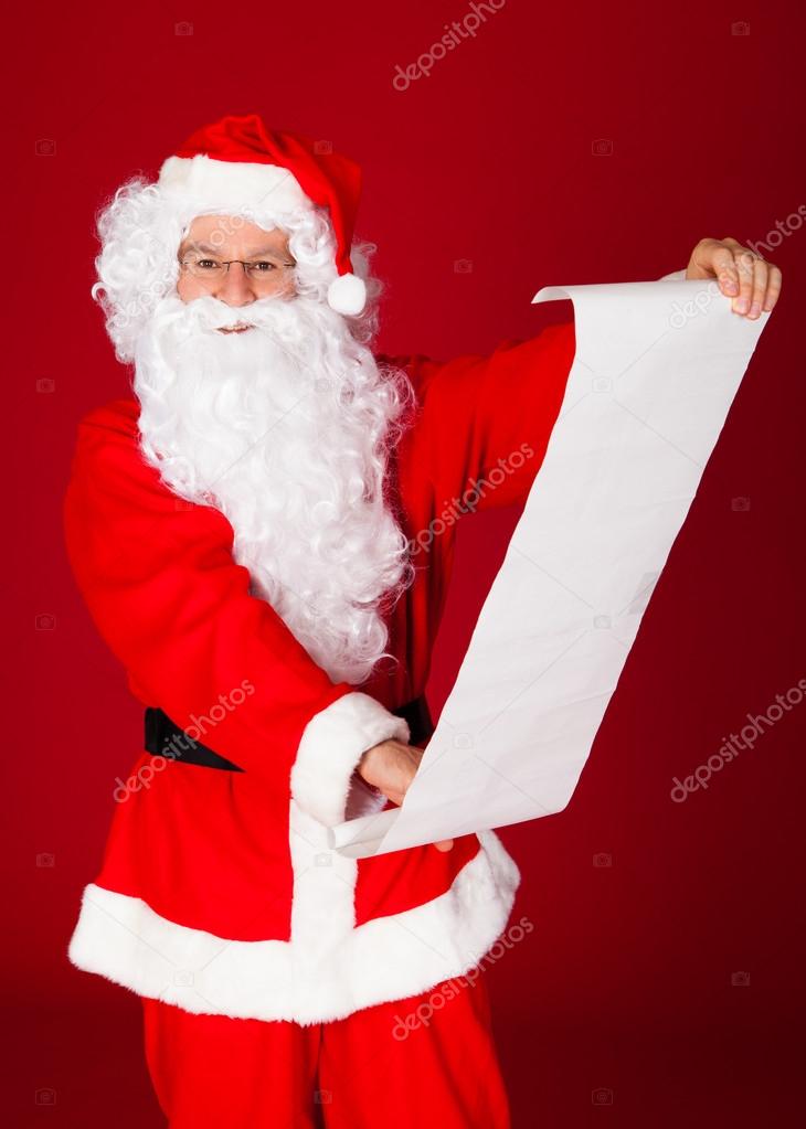 Portrait of a santa holding paper scroll