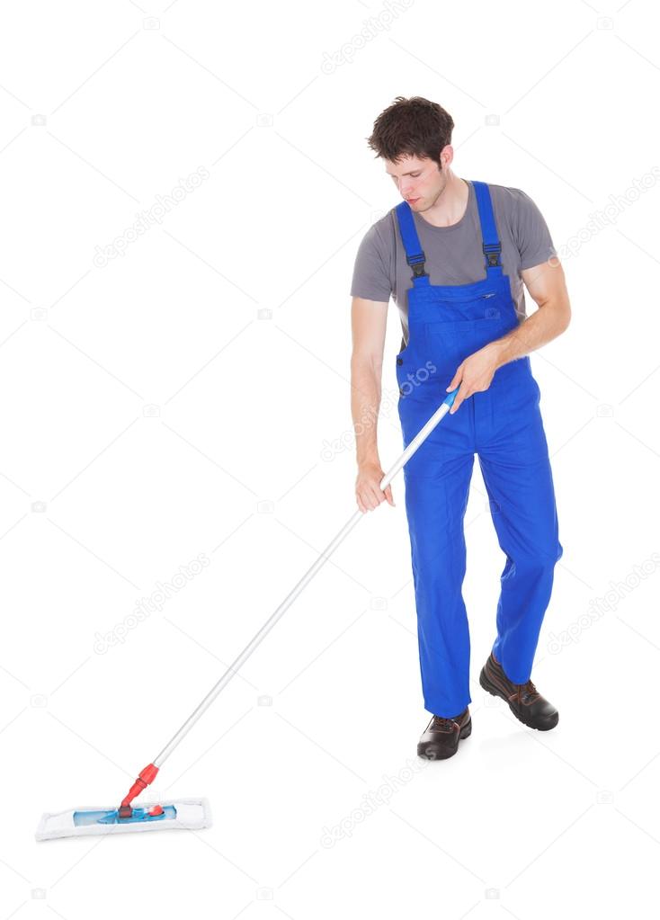 Young Man Cleaning With Mop