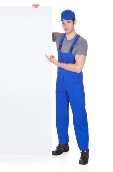 Male Worker Holding Blank Placard — Stock Photo, Image