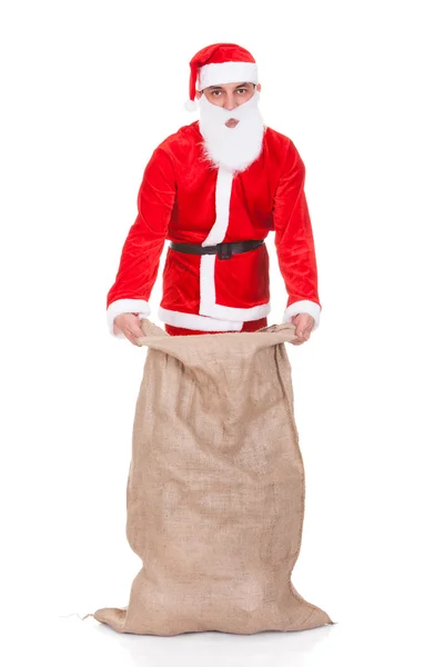 Santa Filling Bag With Gifts — Stock Photo, Image