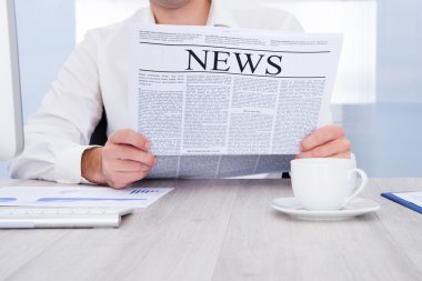 işadamı okuma gazete