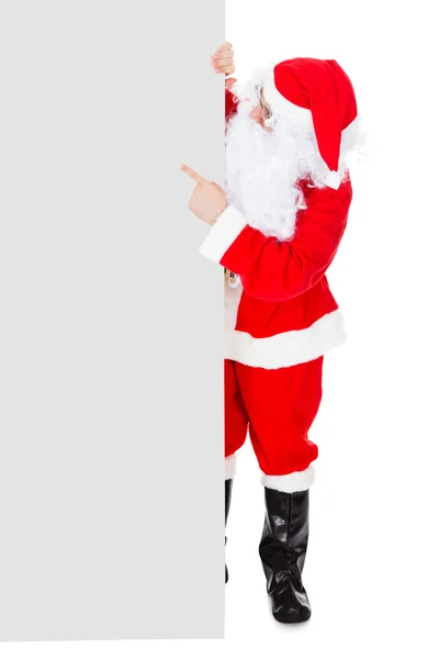 Retrato de um Papai Noel segurando cartaz em branco — Fotografia de Stock