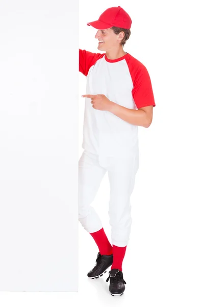 Baseballspieler mit leerem Plakat — Stockfoto