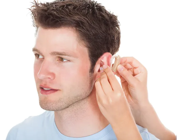 Person Adjusting Hearing Aid — Stock Photo, Image