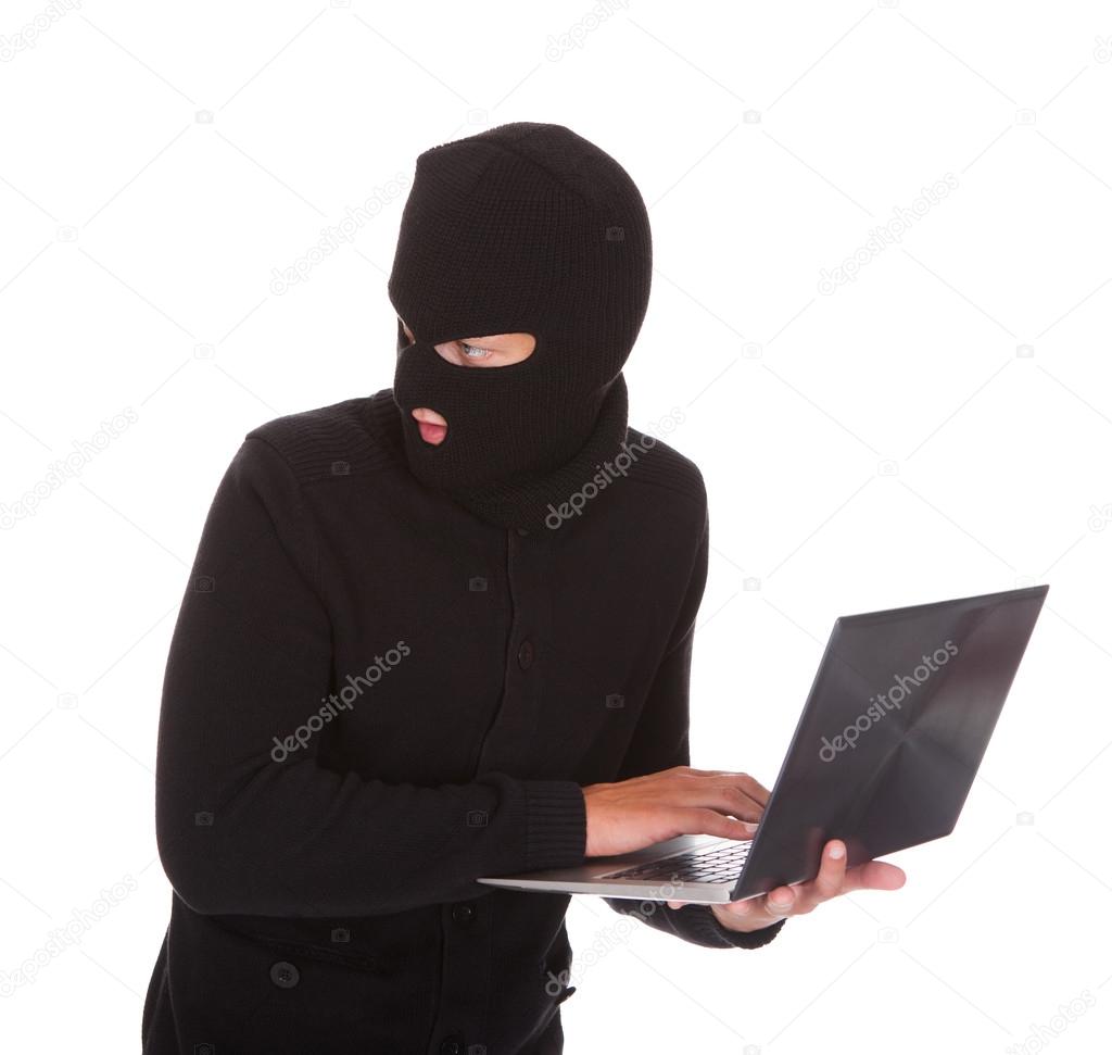 Burglar Using Laptop