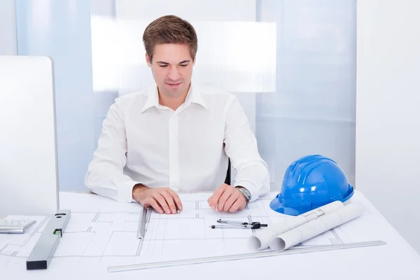 Young Architect Drawing Plan On Blueprint — Stock Photo, Image