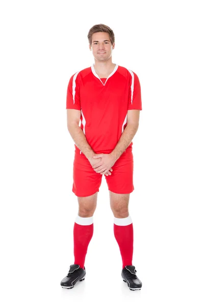 Fotbollspelare i röd tröja — Stockfoto