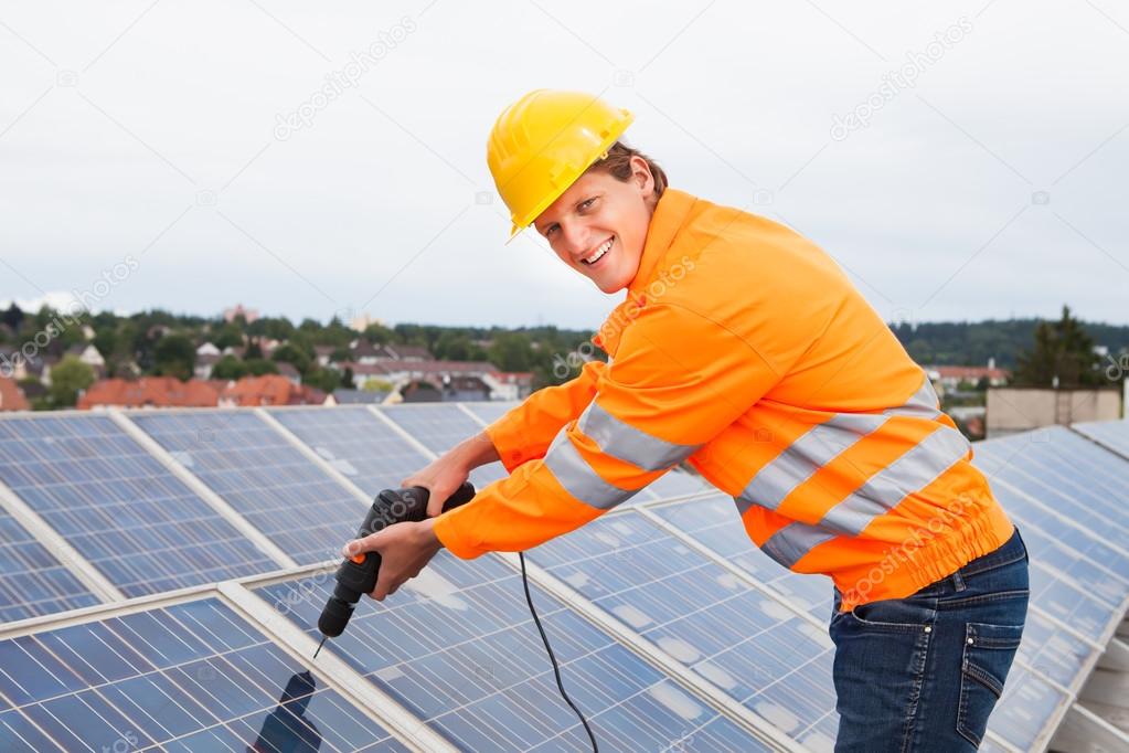 Engineer Adjusting Solar Panels