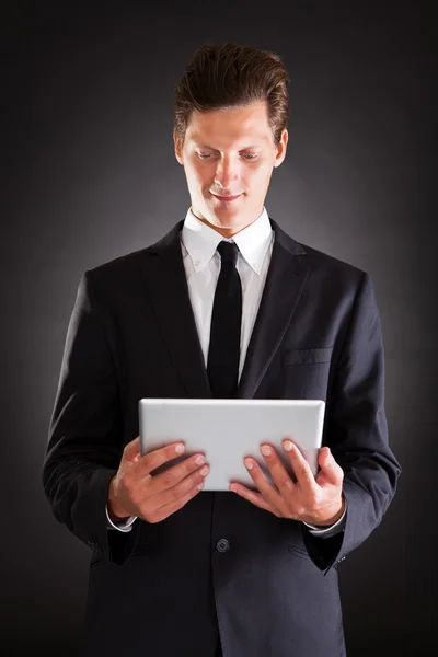 Young Businessman Using At Digital Tablet — Stock Photo, Image