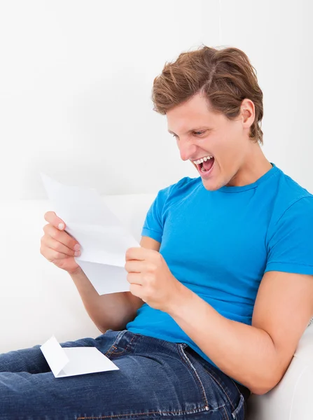 Happy Man Looking At Paper — Stock Photo, Image