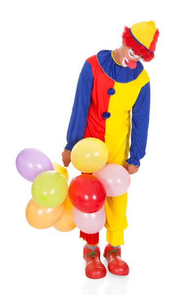 Triest joker met ballonnen — Stockfoto