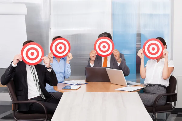 Businesspeople Holding Dartboard — Stock Photo, Image