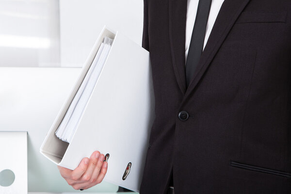 Businessman Carrying Folder