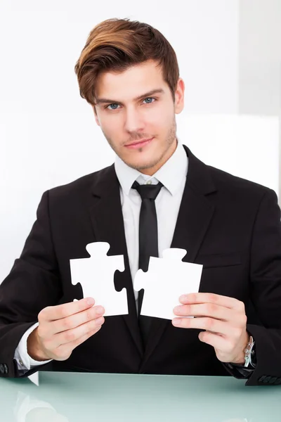 Businessman Solving Jigsaw Puzzle — Stock Photo, Image