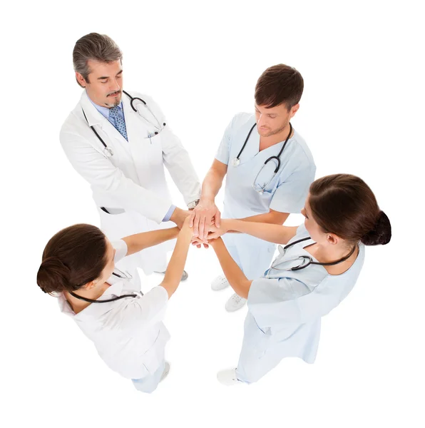 Lekarze układanie rąk — Zdjęcie stockowe