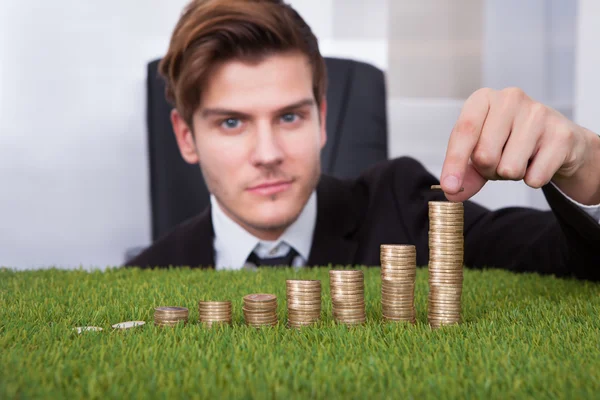 Businessman Arranging Coins — Stock Photo, Image