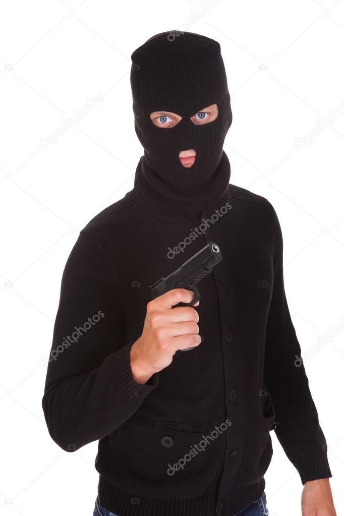 Burglar Holding Hand Gun