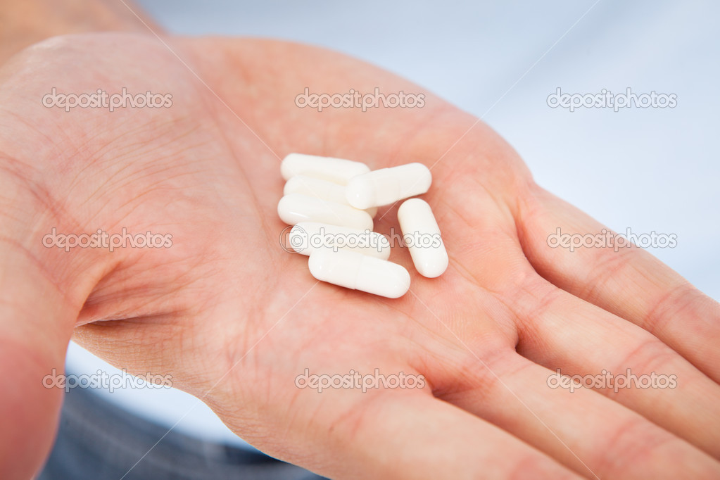 Hand Holding Medicines