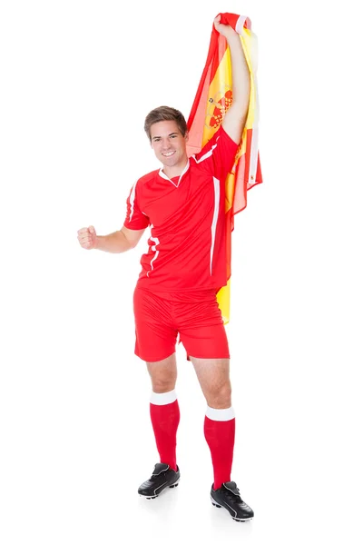 Joueur de football tenant le drapeau espagnol — Photo