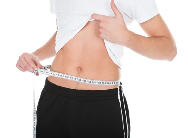 Man Measuring His Waistline — Stock Photo, Image