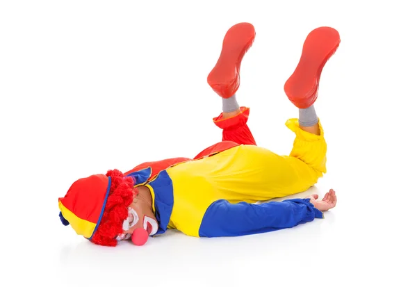 Uitgeput clown liggend op voorzijde — Stockfoto