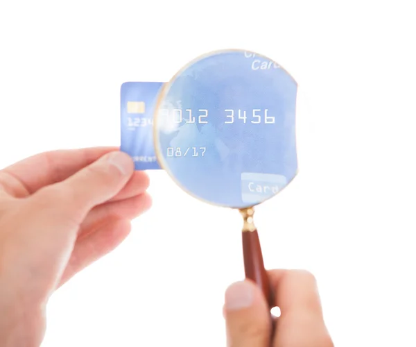 Man Holding Credit Card And Magnifying Glass — Stock Photo, Image