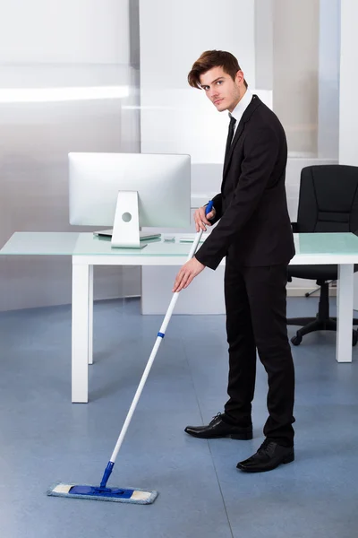 Businessman Cleaning Office — Stock Photo, Image