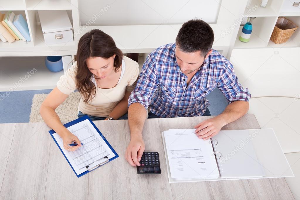 Couple Calculating Bills