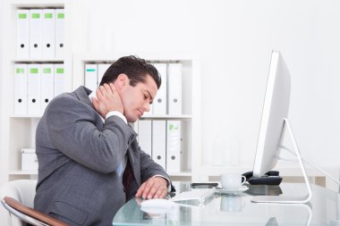 Businessman Suffering From Neck Pain