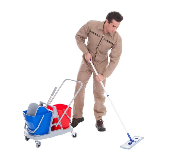 Férfi sweeper tisztítás emeleten — Stock Fotó