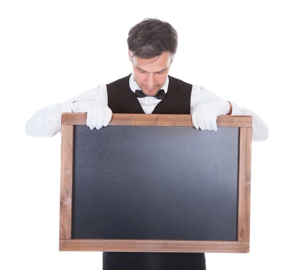 Waiter Holding Chalkboard — Stock Photo, Image