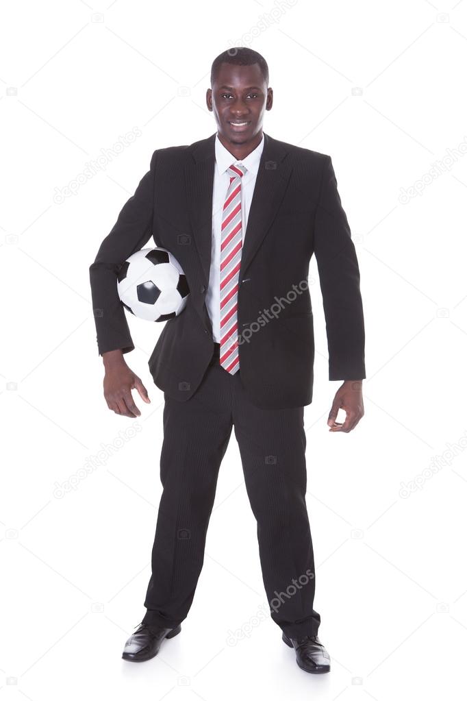 Businessman Holding Football