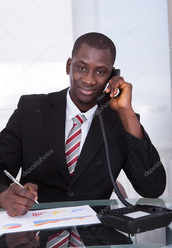 African Businessman Talking On Telephone