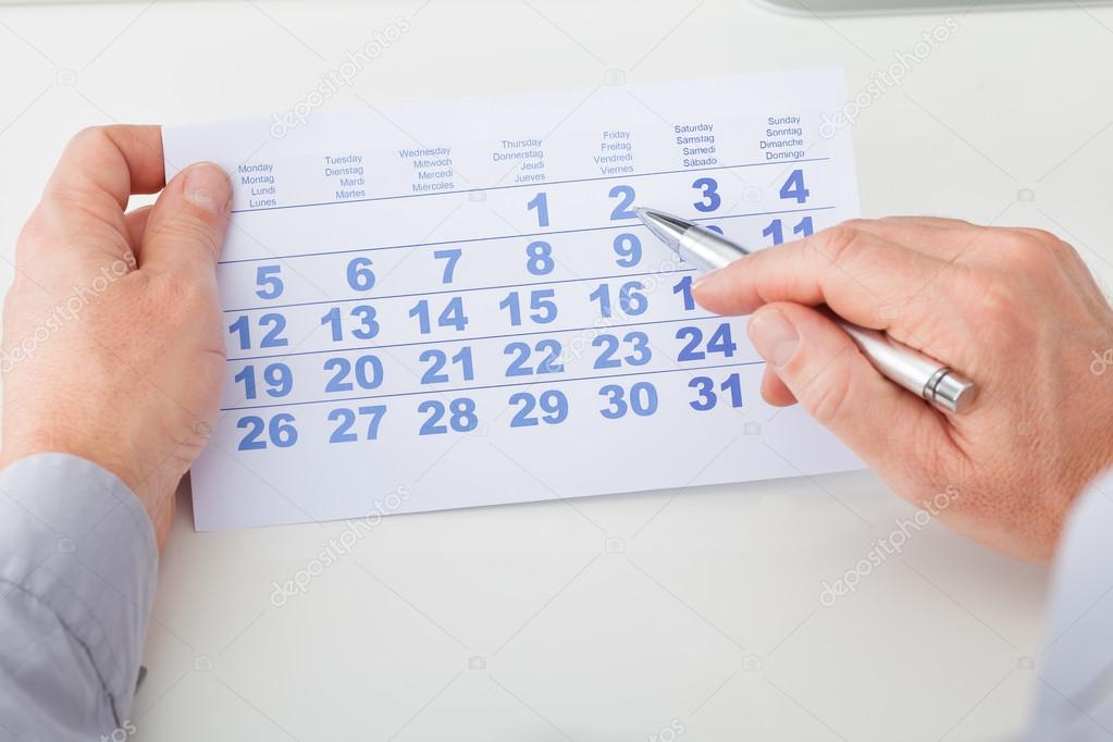Hand Holding Calendar And Pen — Stock Photo © AndreyPopov 38713199