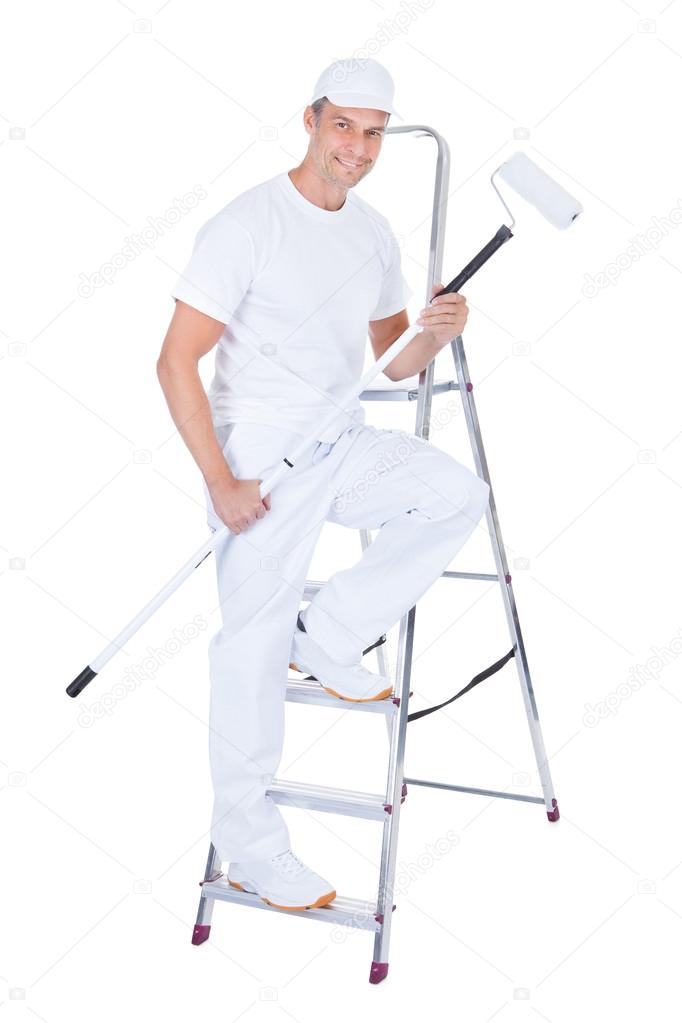 Painter With Paint Roller And Ladder