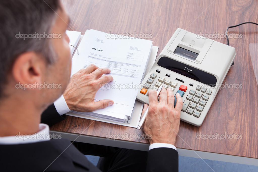 Businessman Calculating Invoice
