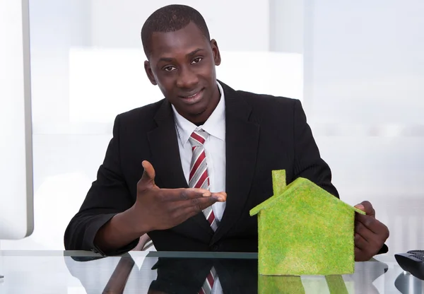 Businessman Presenting Ecological House — Stock Photo, Image